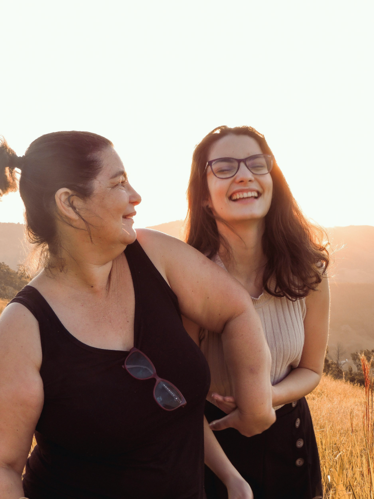 People smiling together outdoors